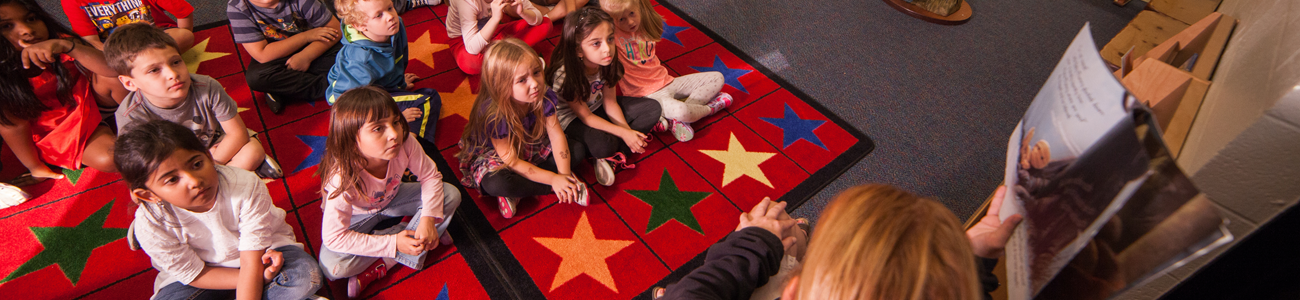 student listening on carpet 